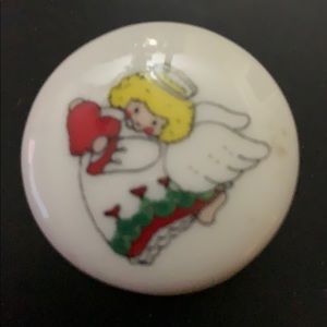 Small vintage trinket box angel holding a heart